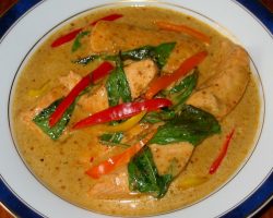 Poached salmon in red curry sauce